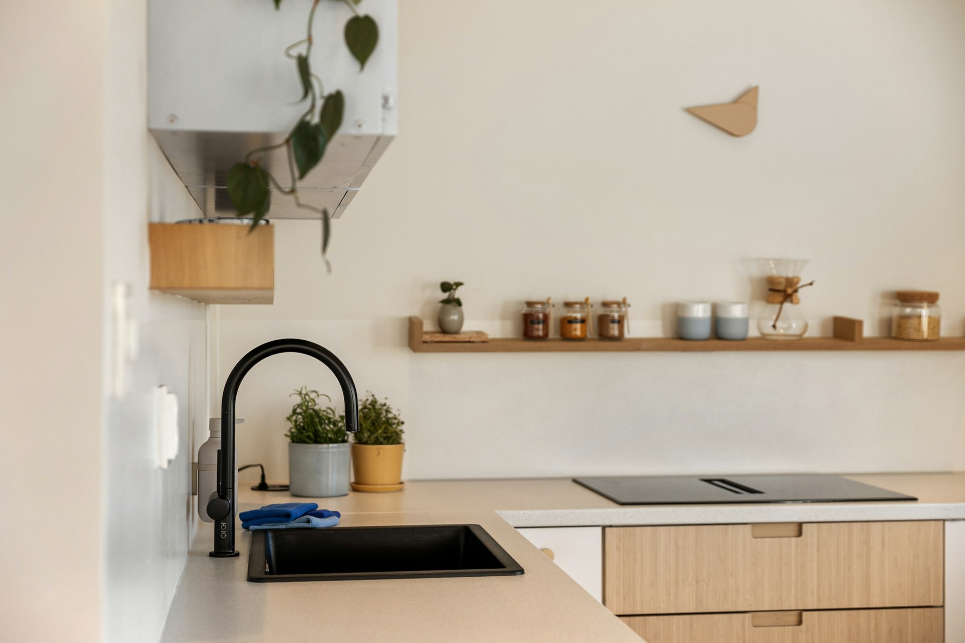 A kitchen with a sink a counter and a window
